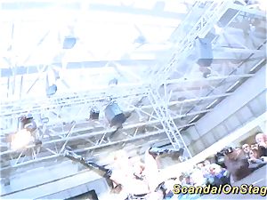 huge-boobed stunner handballing on public stage